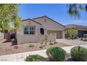 Charming single-story home featuring a two-car garage, desert landscaping, and a private gated courtyard at 390 Inflection St, Henderson, NV 89011