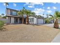 Inviting two-story home featuring desert landscaping and a spacious two-car garage at 5035 Meadow Grove Ct, Las Vegas, NV 89120