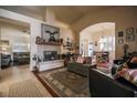 Inviting living room with a fireplace, stylish decor, and an open floor plan at 5844 Gushing Spring Ave, Las Vegas, NV 89131