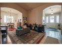 Spacious living area with tile floors, arched doorways, and abundant natural light at 5844 Gushing Spring Ave, Las Vegas, NV 89131