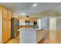 Bright kitchen features stainless appliances, granite countertops, and a central island at 6582 Cartgate Ct, Las Vegas, NV 89110