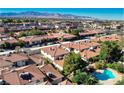 An elevated view of a Las Vegas neighborhood showcases the red-tiled roofs and mature landscaping at 6733 W Charleston Blvd # 3, Las Vegas, NV 89146