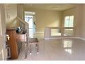 Inviting entryway with tile flooring, neutral walls, and a staircase leading to the second level at 6778 Goose Watch Ct, Las Vegas, NV 89139