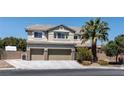 Charming two-story home with a three-car garage and a well-manicured front yard with mature trees at 7360 Dolphine Crest Ave, Las Vegas, NV 89129