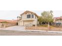 Charming two-story home with a two-car garage and desert landscaping at 7445 Shangri La Ave, Las Vegas, NV 89147