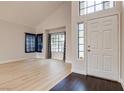 Bright living room features high ceilings, large windows, and modern flooring at 7445 Shangri La Ave, Las Vegas, NV 89147
