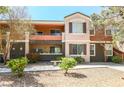 Inviting multi-story condo featuring a private balcony with outdoor seating space at 7704 Himalayas Ave # 204, Las Vegas, NV 89128