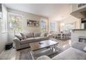 Open concept living and dining area with neutral color scheme and plenty of natural light at 7704 Himalayas Ave # 204, Las Vegas, NV 89128