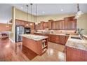 Gourmet kitchen with granite countertops, stainless steel appliances, and custom cabinetry at 8216 W Hammer Ln, Las Vegas, NV 89149