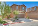 Attractive home featuring a 2-car garage, complemented by drought-resistant landscaping and a private driveway at 8783 Halcon Ave, Las Vegas, NV 89148