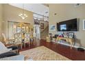 Spacious living room with high ceilings, hardwood floors, and staircase at 916 Bob Barney Ave, North Las Vegas, NV 89086