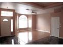 Bright living room with hardwood floors and large windows providing natural light at 128 Golf Course St, Las Vegas, NV 89145