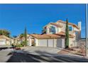 Well-maintained two-story home featuring a three-car garage and tile roof at 1800 Summit Pointe Dr, Las Vegas, NV 89117