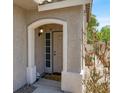 Inviting front entrance with security door, neutral tones and decorative stone accents at 1861 Windward Ct, Henderson, NV 89012