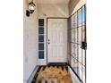 Inviting front entrance with security door, neutral tones, and a welcome mat at 1861 Windward Ct, Henderson, NV 89012