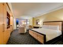 Spacious bedroom features a plush bed, cozy seating area, and large windows, creating a relaxing retreat at 2000 Fashion Show Dr # 5509, Las Vegas, NV 89109