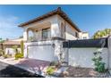 Attractive two-story house with a balcony, tile roof, and attached garage, set in a well-kept neighborhood at 2017 Plaza De Cielo, Las Vegas, NV 89102