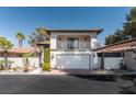 Charming two-story home with a balcony, tile roof, and gated entry for added curb appeal at 2017 Plaza De Cielo, Las Vegas, NV 89102