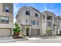 Contemporary two-story home featuring modern architecture and a gray exterior at 2115 Noble Perch St, Las Vegas, NV 89138