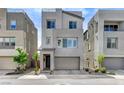 Modern two-story home with a two-car garage and minimalistic landscaping at 2115 Noble Perch St, Las Vegas, NV 89138