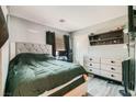 Comfortable bedroom with modern furniture, neutral walls, and ample closet space at 2301 Cambridge Elms St, North Las Vegas, NV 89032