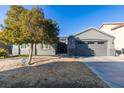 Lovely single-story home featuring a well-manicured front yard and a convenient two-car garage at 2712 Peekskill Ave, Henderson, NV 89052