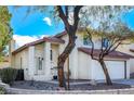 Charming two-story home featuring a well-manicured front yard and a two-car garage at 3000 Waterview Dr, Las Vegas, NV 89117