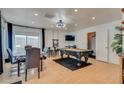 Game room with a pool table, dining table, and a mounted TV for leisure and entertainment at 3886 Green Leaf Dr, Las Vegas, NV 89120