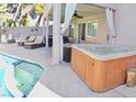 Backyard pool, hot tub, and lounge area for relaxing and entertaining in the desert sun at 3886 Green Leaf Dr, Las Vegas, NV 89120