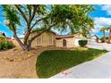 Charming single-story home with well-kept lawn, lovely desert landscaping, and an attached two-car garage at 3905 Cherokee Ave, Las Vegas, NV 89121