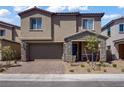 Charming two-story home with a stone-accented front porch and well-maintained landscaping at 4436 Mural Glen Ct, North Las Vegas, NV 89084