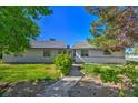 Charming home exterior with a walkway, lush greenery and a well maintained yard at 481 Jarvis Rd, Pahrump, NV 89060