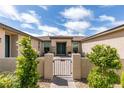 Inviting front entrance with a charming courtyard and well-manicured landscaping at 5120 Lone View Pl, Las Vegas, NV 89149