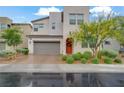 Charming two-story home with a neutral palette, two-car garage, and manicured landscaping at 525 Monarch Ridge Ct, North Las Vegas, NV 89084