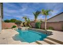 Gorgeous private pool and spa area surrounded by lush landscaping and brick privacy fence at 5903 Karnes Ranch Ave, Las Vegas, NV 89131