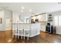 Bright kitchen features a breakfast bar with seating and stainless steel appliances at 5965 Sierra Medina Ave, Las Vegas, NV 89139