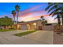 Charming one-story home with a well-maintained yard, two-car garage, and gated RV parking at 6345 Cinnabar Ridge Ave, Las Vegas, NV 89130