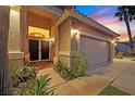 Home's inviting front entrance and well-lit walkway leads to the beautiful double-door entrance at 6345 Cinnabar Ridge Ave, Las Vegas, NV 89130