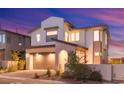 Charming two-story home featuring a modern design, a two-car garage, and desert landscaping at 828 Parker Mesa St, Las Vegas, NV 89138