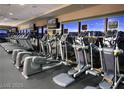 Well-equipped gym with treadmills, elliptical machines, and floor to ceiling windows overlooking the city at , Henderson, NV 89012