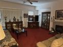 Cozy living room with plush sofas, fireplace, and classic decor, creating a warm and inviting atmosphere at 10023 Liberty View Rd, Las Vegas, NV 89148