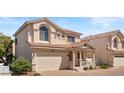 Two-story home featuring a two-car garage, cozy front porch and terracotta tile roof in a desirable location at 10276 Cherry Brook St, Las Vegas, NV 89183