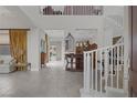 Spacious foyer with high ceilings, decorative furnishings, and open staircase at 11944 Dolcemente Ln, Las Vegas, NV 89138