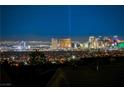 Breathtaking night view of the Las Vegas strip from this home's vantage point at 1637 Wellington Springs Ave, Henderson, NV 89052