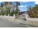 View of the home, showcasing the front yard and driveway at 1674 Palma Vista Ave, Las Vegas, NV 89169