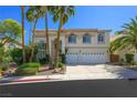Charming two-story home featuring a spacious driveway and a manicured lawn, perfect for Gathering living and curb appeal at 2097 Eaglepath Cir, Henderson, NV 89074