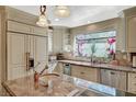 Beautiful kitchen featuring granite countertops, stainless steel appliances, and custom cabinets at 3141 E Katie Ave, Las Vegas, NV 89121