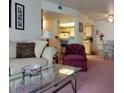 Inviting living room featuring a comfortable sofa, decorative pillows, and a clear view into the adjacent kitchen at 3550 Bay Sands Dr # 2063, Laughlin, NV 89029