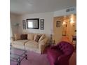 Cozy living room with soft lighting, modern decor, and open access to a hallway and bathroom for convenience at 3550 Bay Sands Dr # 2063, Laughlin, NV 89029