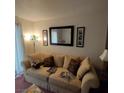 Relaxing living room with a plush sofa, stylish decor, and natural light creating a welcoming atmosphere at 3550 Bay Sands Dr # 2063, Laughlin, NV 89029